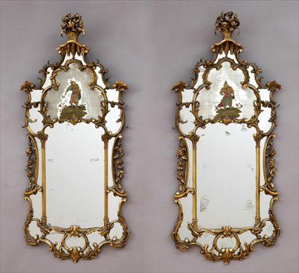 Appraisal: PAIR OF CONTINENTAL ROCOCO REVIVAL GILTWOOD MIRRORS The flower-filled carved