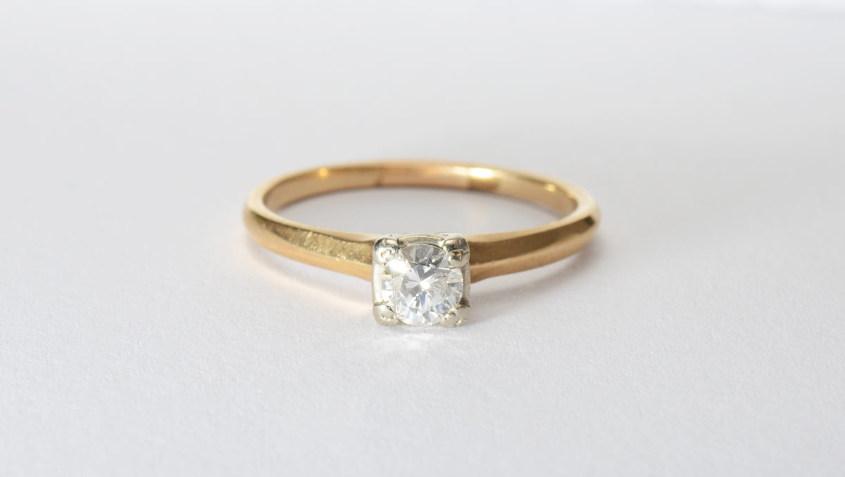 Appraisal: DIAMOND SOLITAIRE ENGAGEMENT RING K yellow gold ring contains one