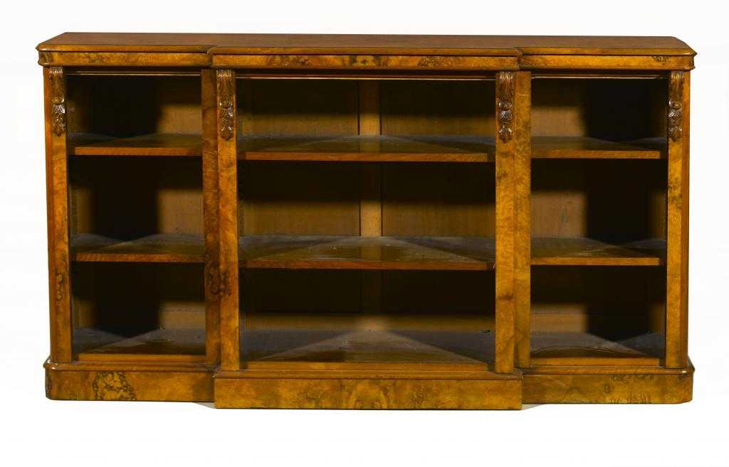 Appraisal: A VICTORIAN WALNUT BREAKFRONT OPEN BOOKCASE in matched veneers applied