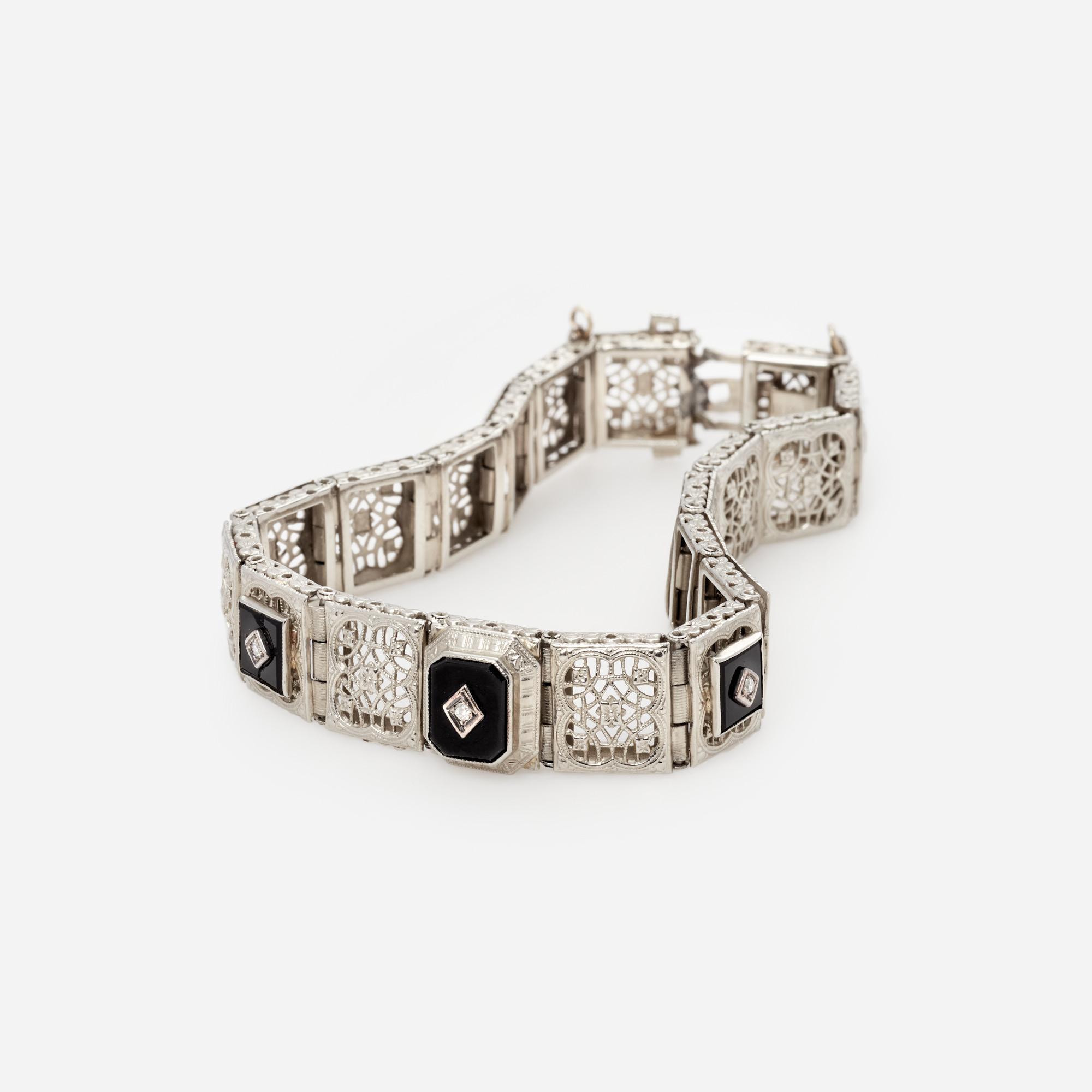 Appraisal: ART DECO K FILIGREE DIAMOND BRACELET BY OSTBY BARTON An