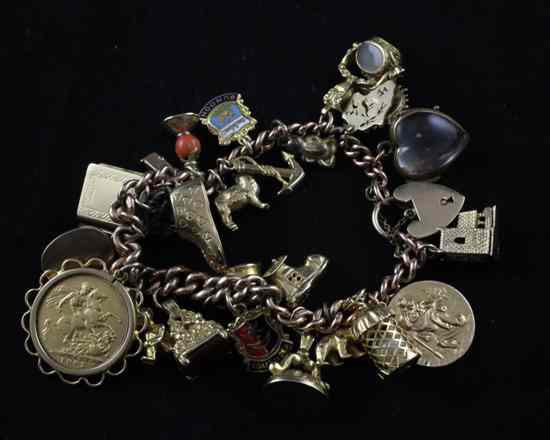 Appraisal: A ct gold curblink bracelet hung with twenty four assorted