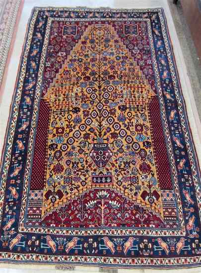 Appraisal: PERSIAN TRIBAL PRAYER RUG having a floral decorated yellow ground