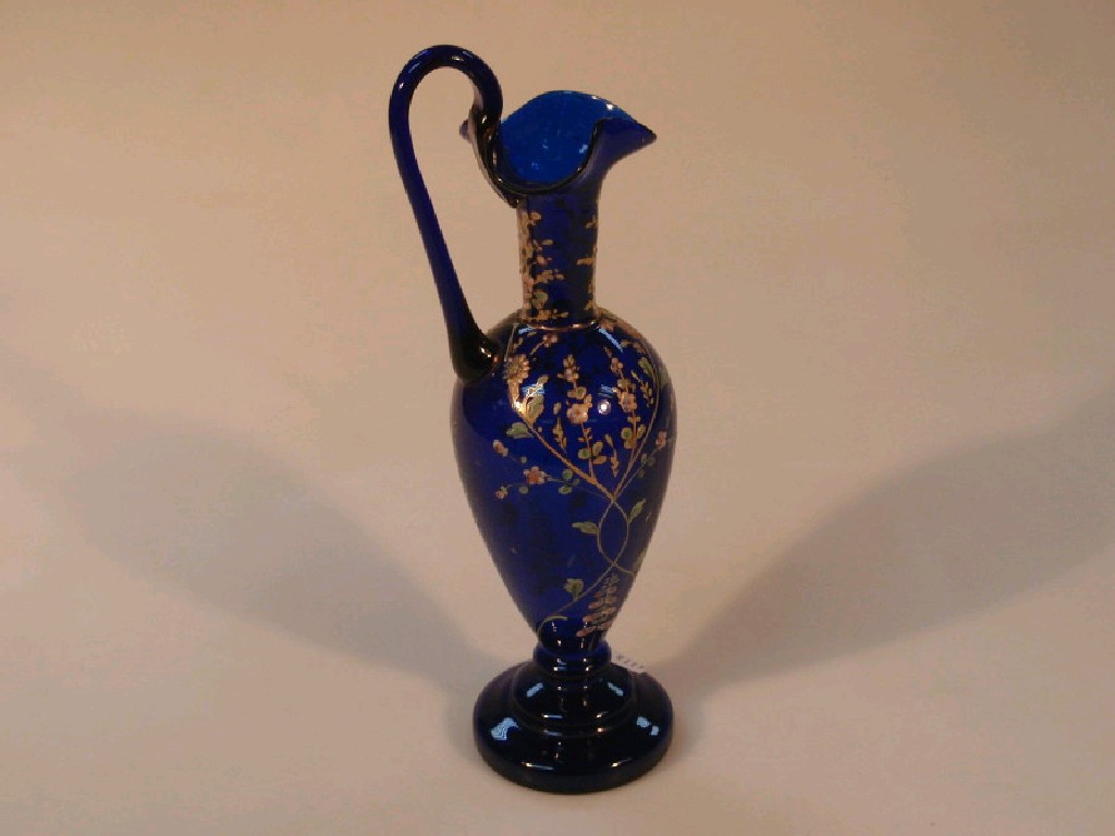 Appraisal: A blue glass ewer of ovoid form with loop handle