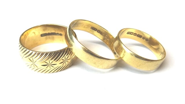 Appraisal: A ct gold decorated wedding ring and two ct gold