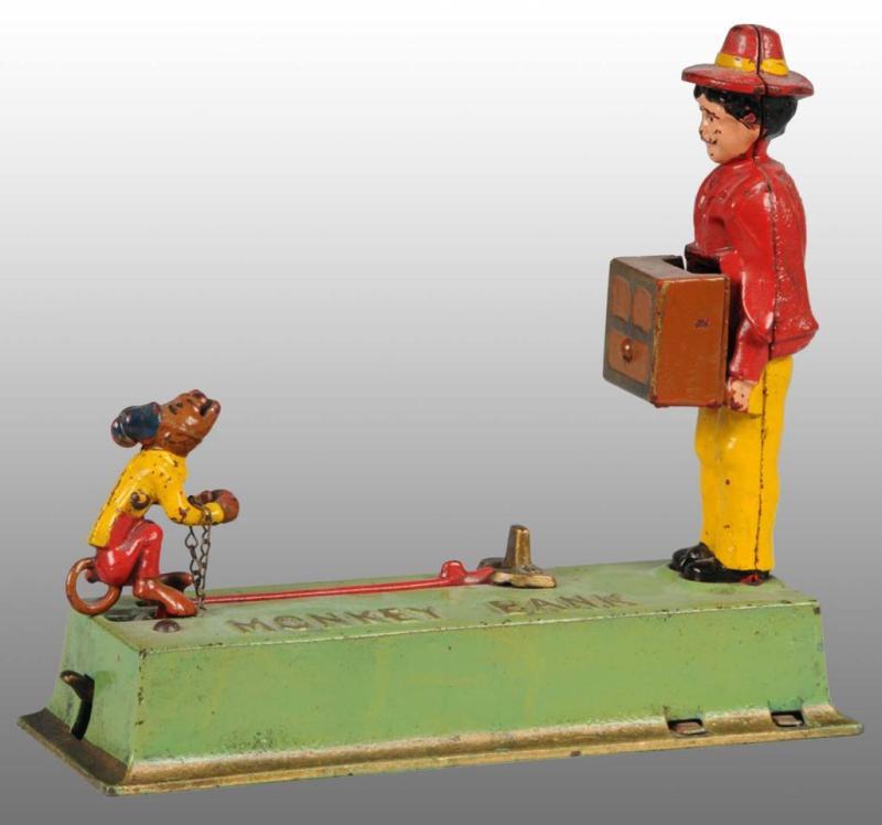 Appraisal: Cast Iron Monkey Bank Mechanical Bank Description Manufactured by Hubley