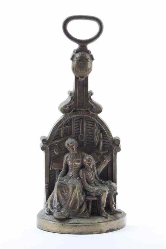 Appraisal: An American Brass Door Stop depicting the boyhood of Lincoln