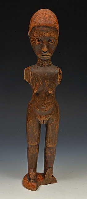 Appraisal: AN OLD AFRICAN CARVED WOOD FEMALE FIGURE losses cm high