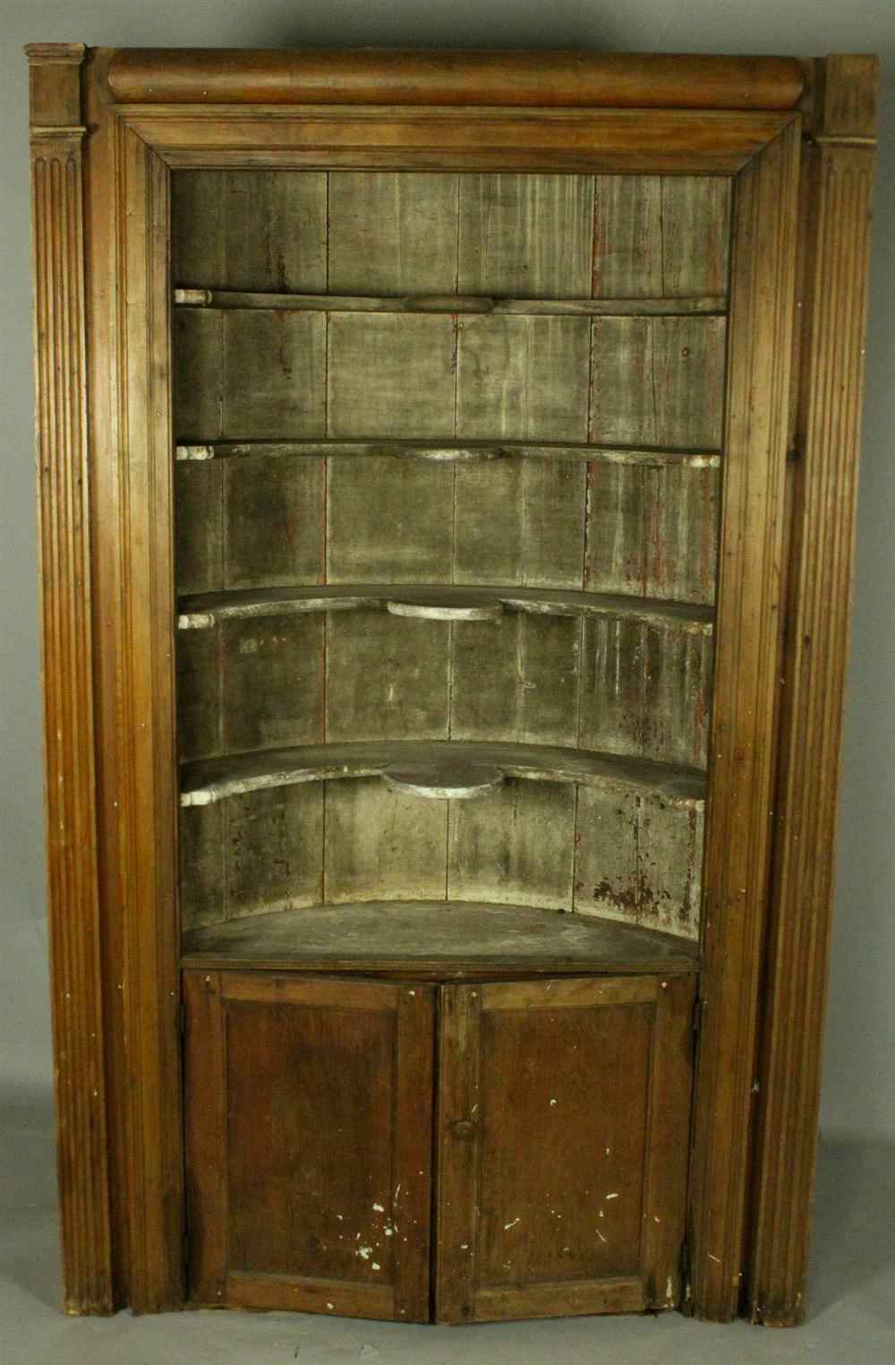 Appraisal: ARCHITECTURAL BARREL BACK CORNER CUPBOARD in one piece having a