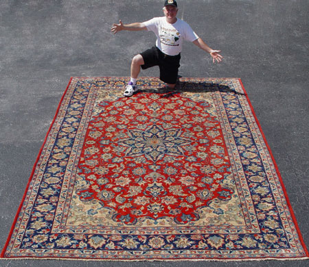 Appraisal: LARGE PERSIAN ISFAHAN CARPET Floral design centered by a star