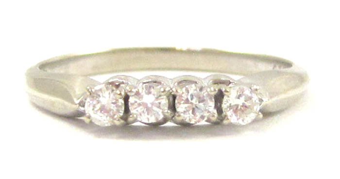 Appraisal: DIAMOND AND FOURTEEN KARAT WHITE GOLD RING set with four