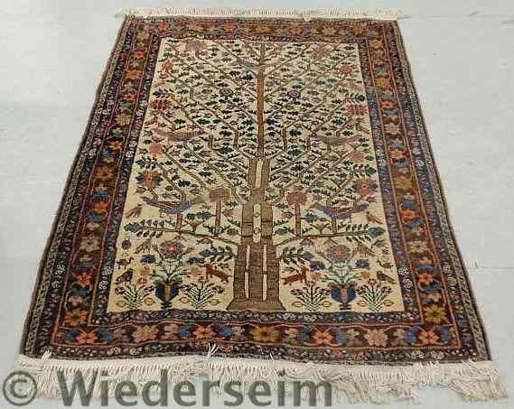 Appraisal: Persian oriental directional carpet with stylized tree and birds 'x