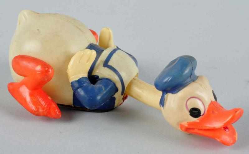 Appraisal: Celluloid Disney Crawling Donald Duck Wind-Up Toy Description Japanese Working