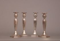 Appraisal: Four Lunt Sterling Candle Sticks Proceeds from the sale of