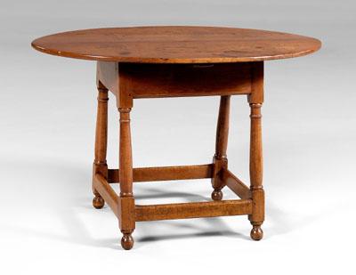 Appraisal: Virginia stretcher-base tavern table walnut throughout oval top with deeply