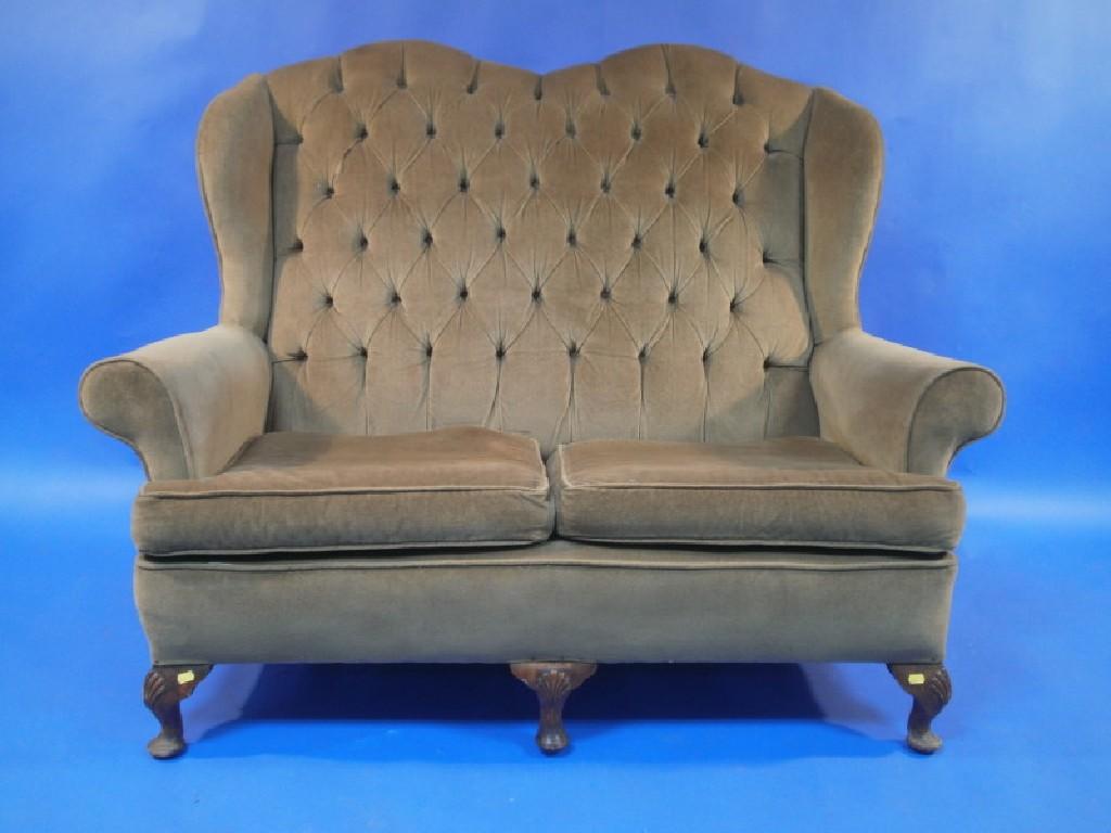 Appraisal: A beech framed Queen Anne style two seater sofa upholstered