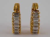 Appraisal: A pair of yellow metal tests carat gold baguette diamond