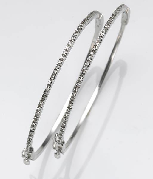 Appraisal: A pair of diamond and k white gold bangles bracelets