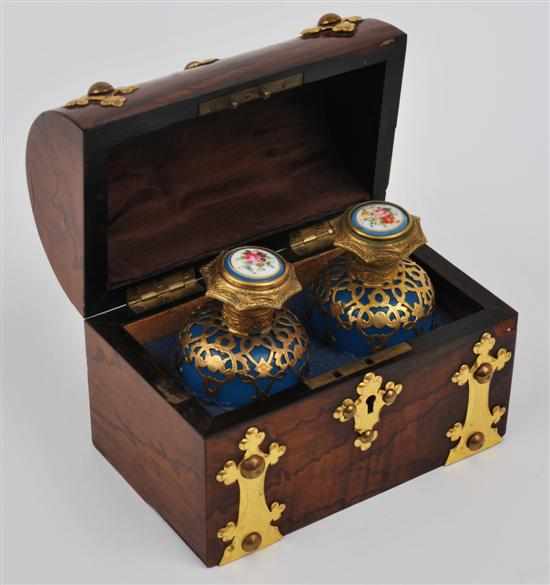 Appraisal: A boxed set of gilt metal mounted perfume bottles Circa