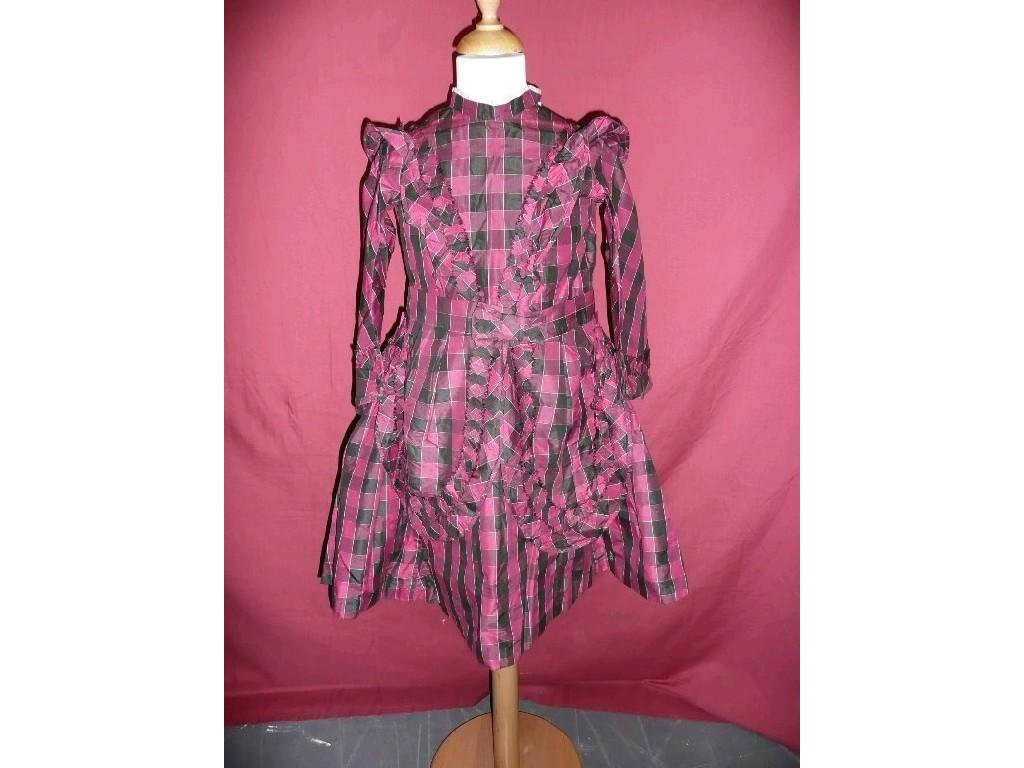 Appraisal: A charming Victorian child's dress with black cerise plum square