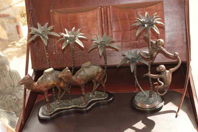 Appraisal: A THREE LIGHT BRONZE CANDELABRUM in the form of two