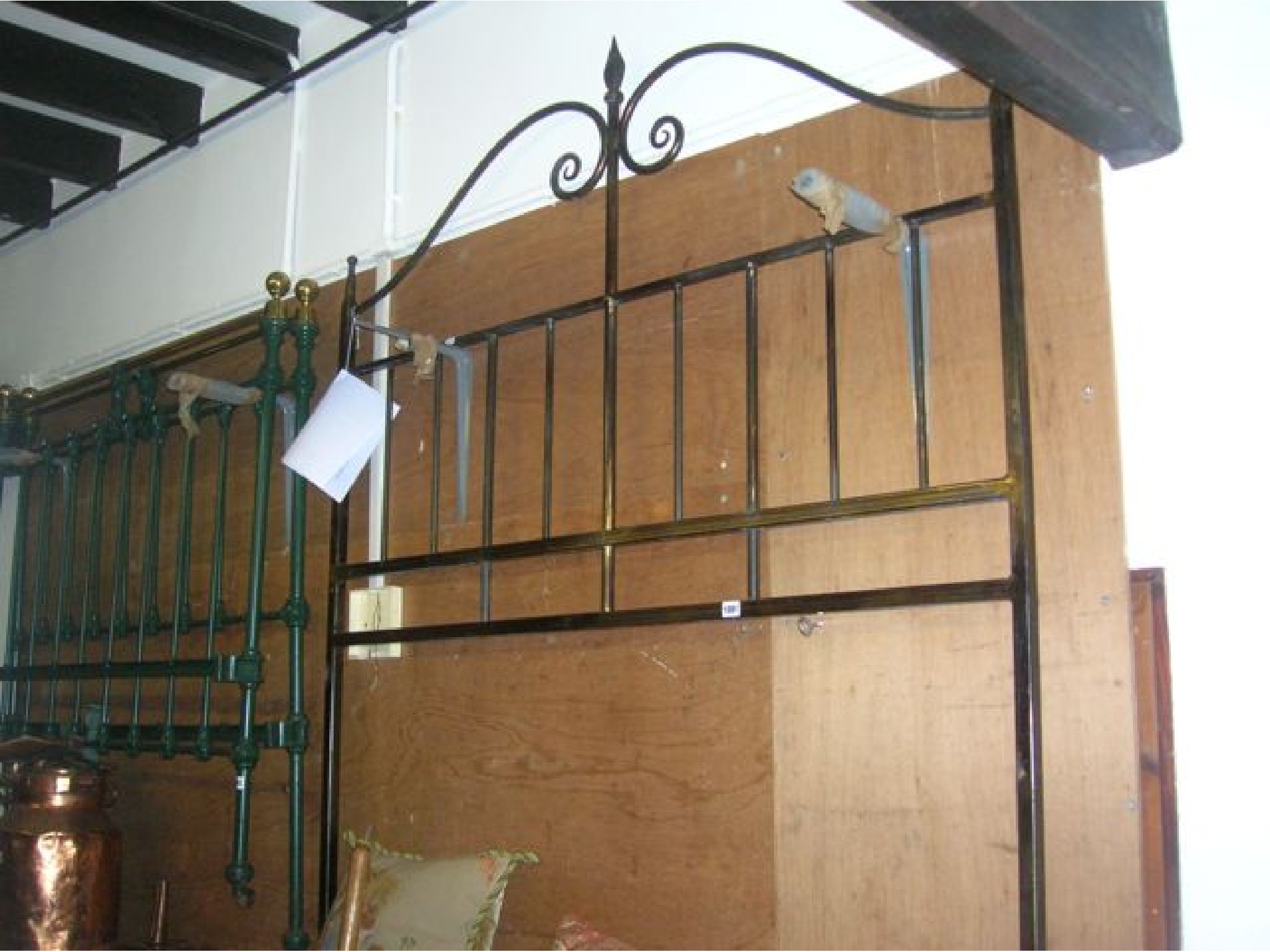 Appraisal: A blacksmith forge made double bed head with central raised