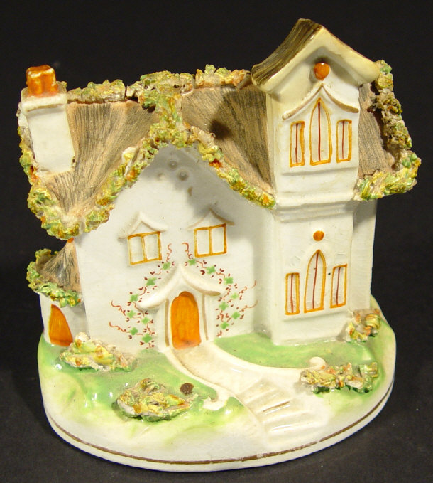 Appraisal: Victorian Staffordshire pottery cottage with relief moulded and hand painted