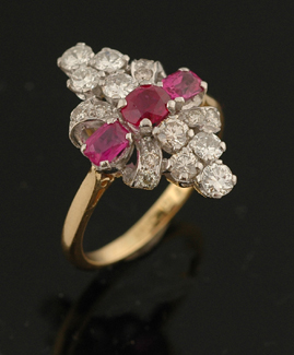 Appraisal: A ruby and diamond ring Of marquise shape with three