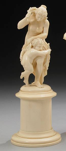 Appraisal: A French carved ivory figural group late th century Modeled