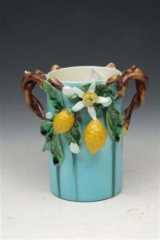 Appraisal: A SARREGUEMINES TURQUOISE POTTERY CYLINDRICAL VASE with applied leaf and