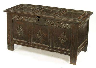 Appraisal: A th century panelled oak chest the triple panel top