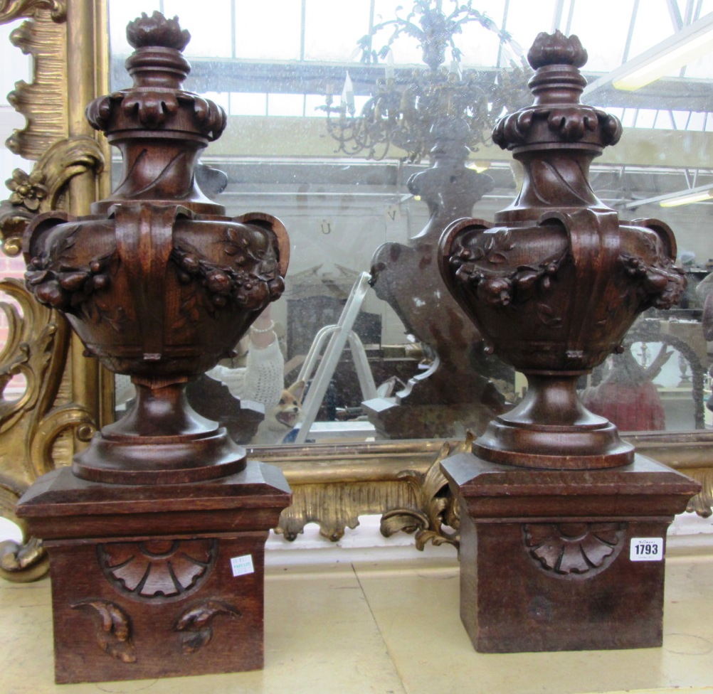 Appraisal: A pair of carved oak newel post finials early th