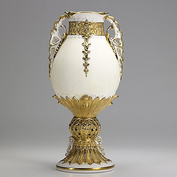 Appraisal: RIESSNER STELLMACHER KESSELPorcelain Amphora double-handled ovoid vase with gilded relief