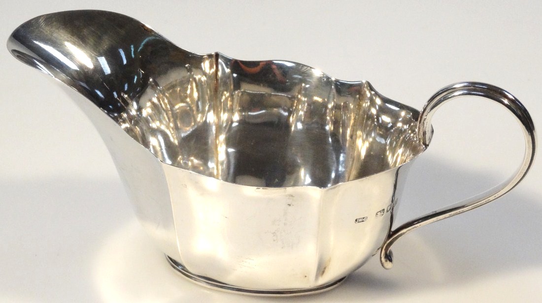 Appraisal: A George VI silver sauce boat by Josiah Williams Co