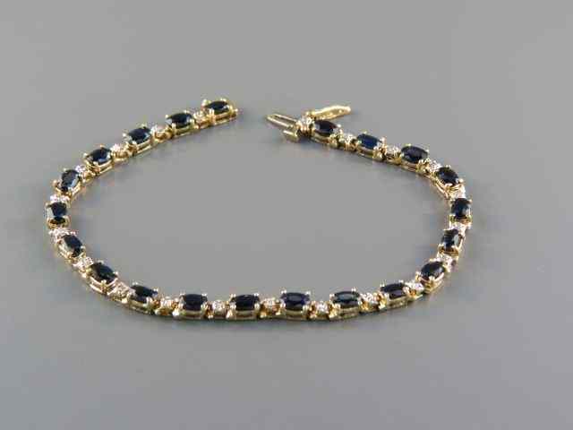 Appraisal: Sapphire Bracelet oval deep blue gems totaling carats with round