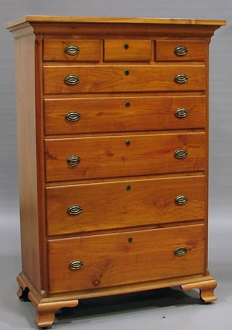 Appraisal: Cove-molded cornice small drawers outer with Quaker locks wide graduated