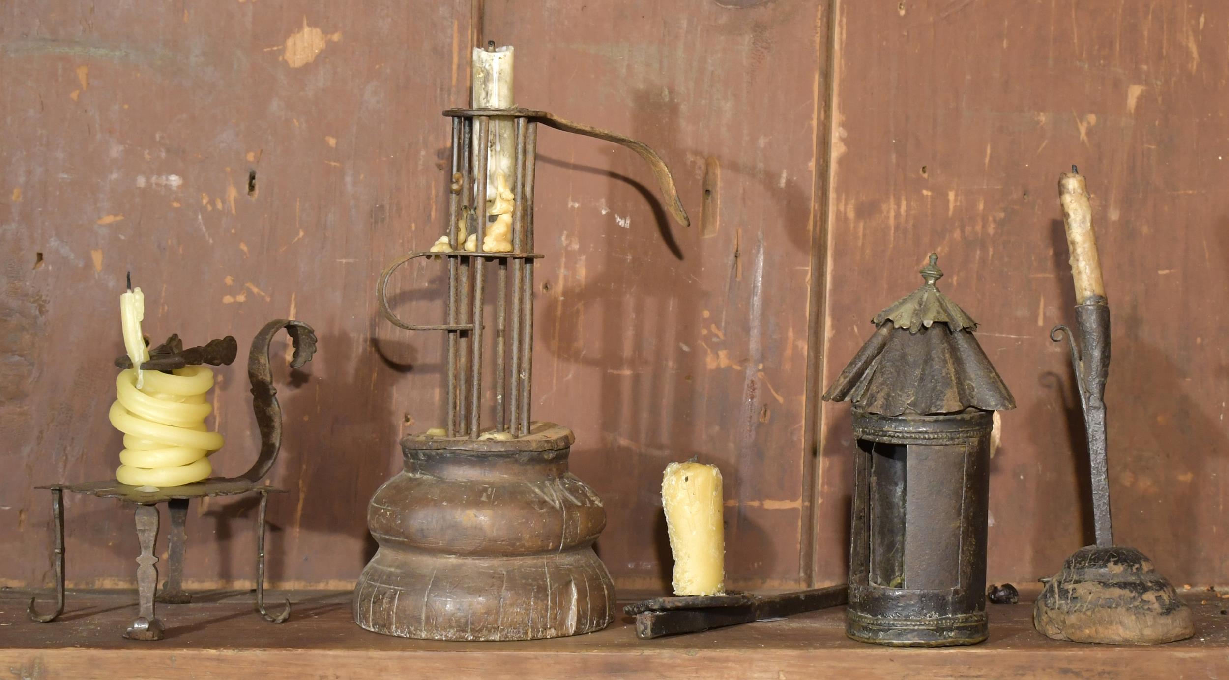 Appraisal: EARLY LIGHTING DEVICES Five early iron and wood lighting devices