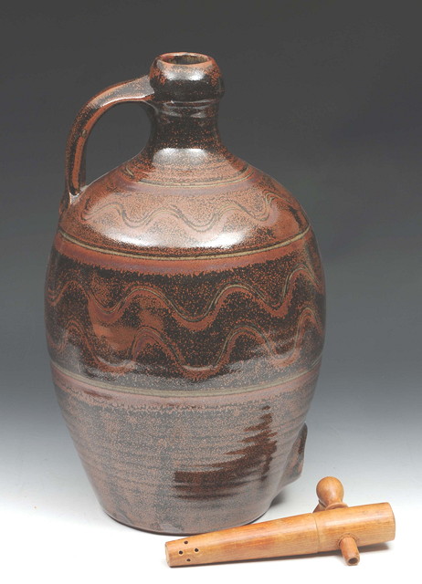 Appraisal: AN ASH GLAZED CIDER JAR probably Winchcombe Pottery with scratched