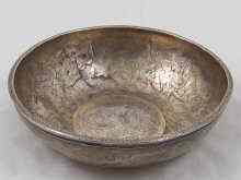 Appraisal: An antique silver Middle Eastern bowl with thickened rim engraved