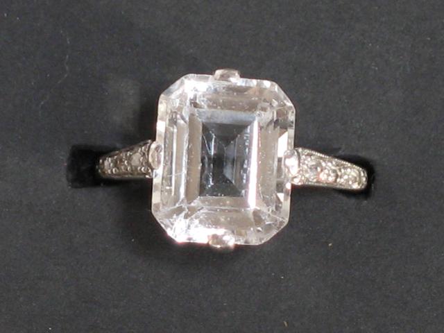 Appraisal: AN ART DECO WHITE TOPAZ DRESS RING the central step-cut