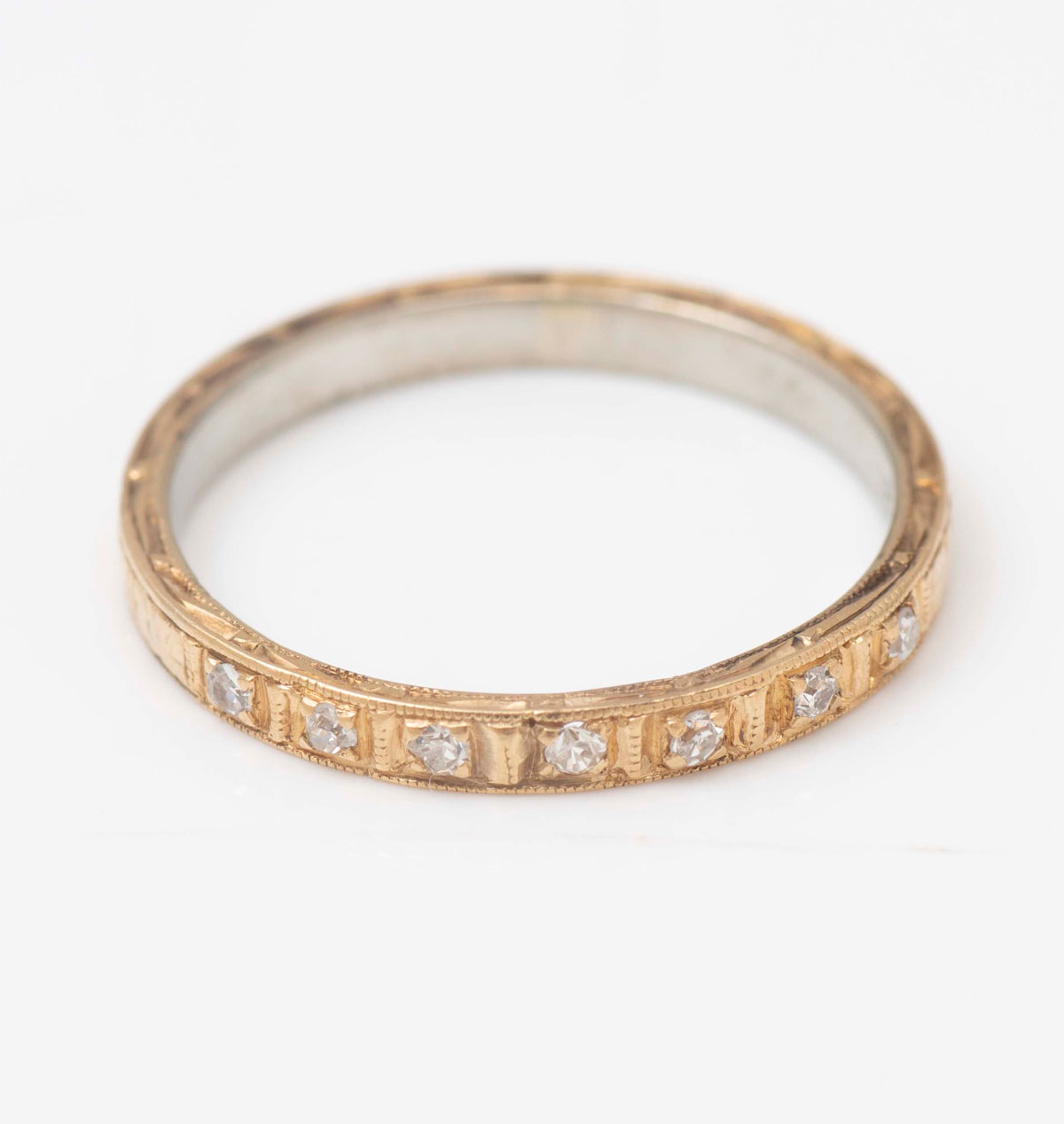 Appraisal: K YELLOW OVER WHITE GOLD DIAMOND BAND Early th century