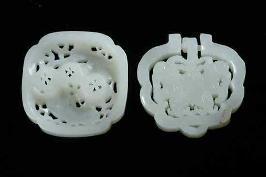 Appraisal: TWO CHINESE CELADON PENDANTS One carved with a butterfly the