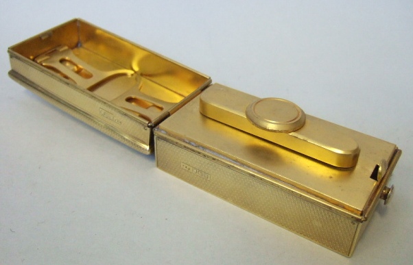 Appraisal: A silver gilt rectangular hinge lidded hair tongs spirit heating