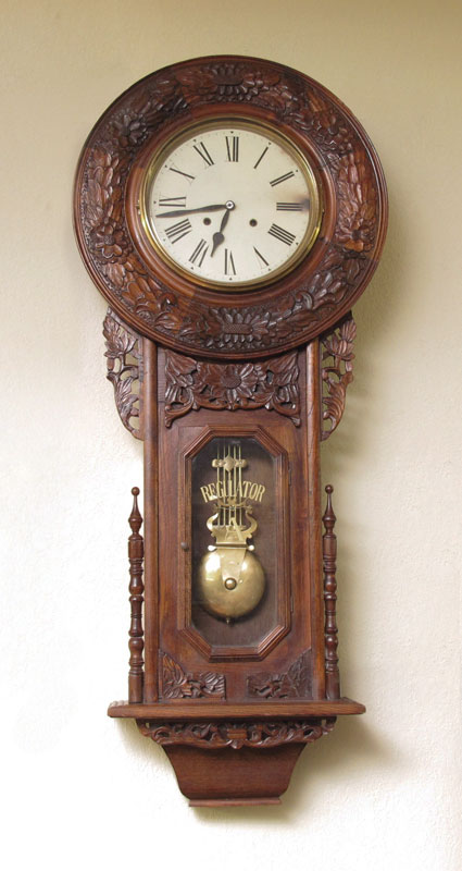 Appraisal: CARVED REGULATOR WALL CLOCK th century production with floral carved