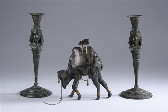 Appraisal: PAIR EGYPTIAN REVIVAL CANDLESTICKS AND BRONZE FIGURE OF CAMEL Sticks