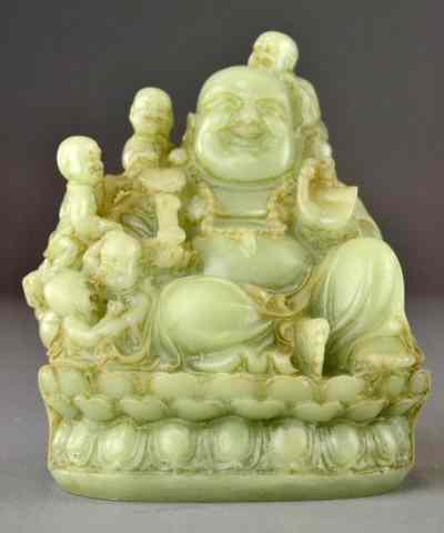 Appraisal: A Chinese Jade Or Hardstone Seated BuddhaFinely carved in celadon