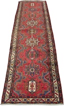 Appraisal: A Heriz Runner Nine interesting medallions woven over pinkish red