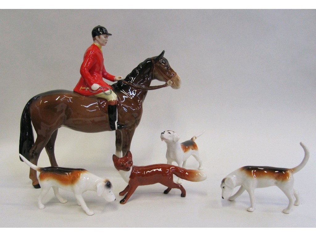 Appraisal: Beswick figure of a huntsman on horse in red jacket