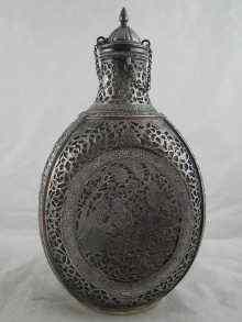 Appraisal: A Persian silver cased glass bottle with stopper the thick