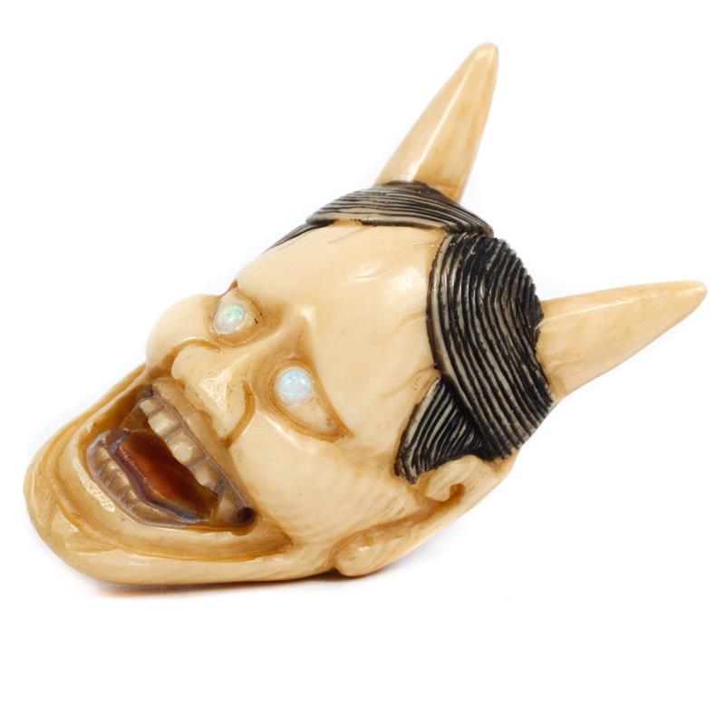 Appraisal: Japanese carved ivory netsuke figure of a Hannya mask with