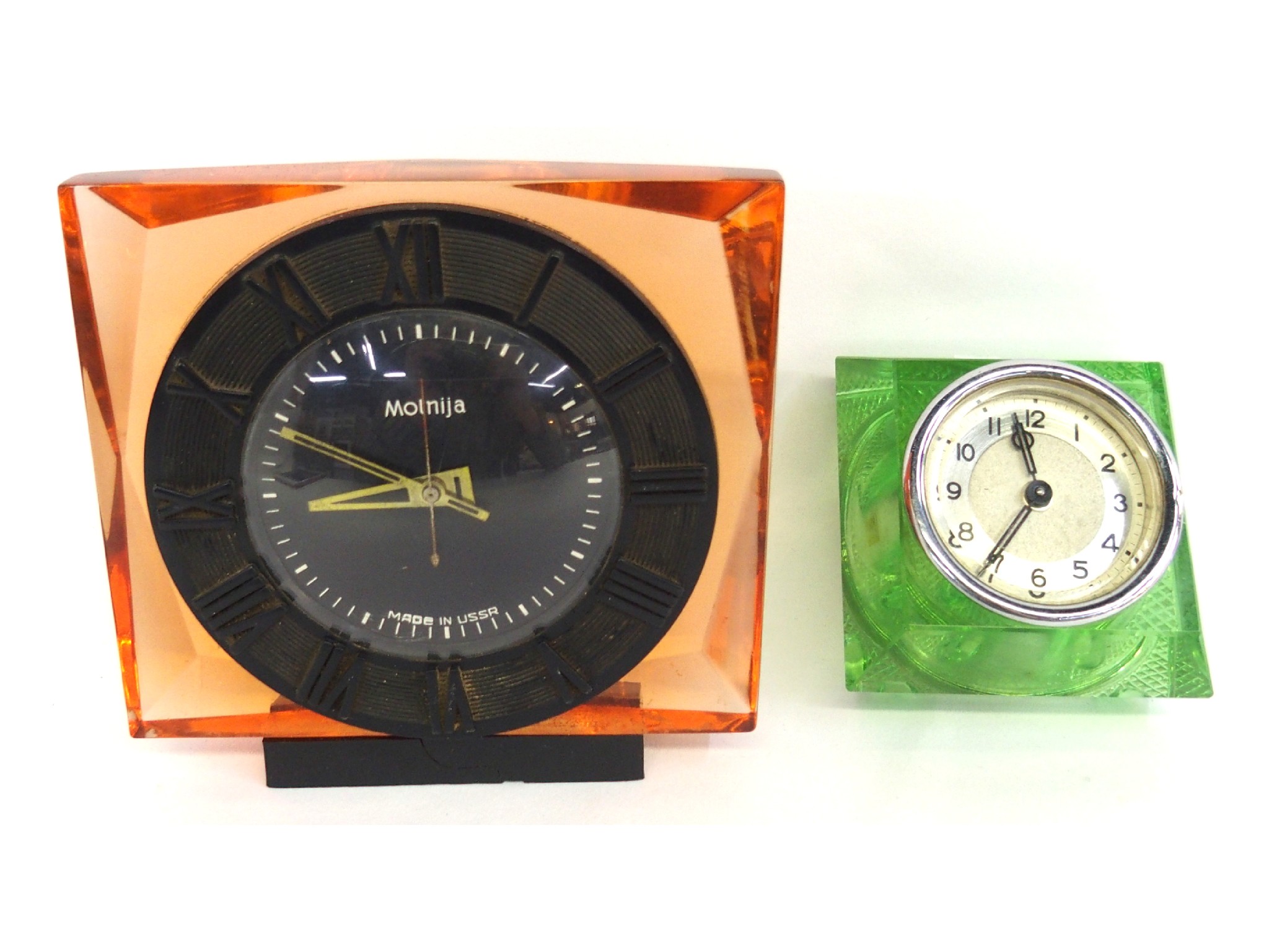 Appraisal: Molnija desk clock and another lucite desk clock